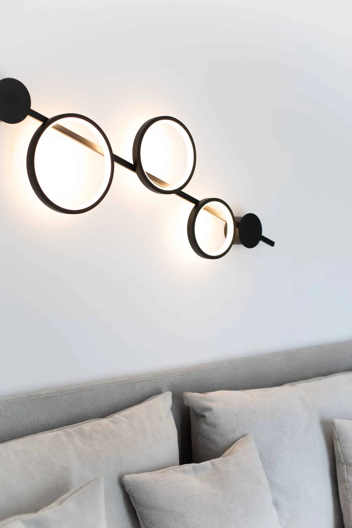 Ring lamp detail above the sofa